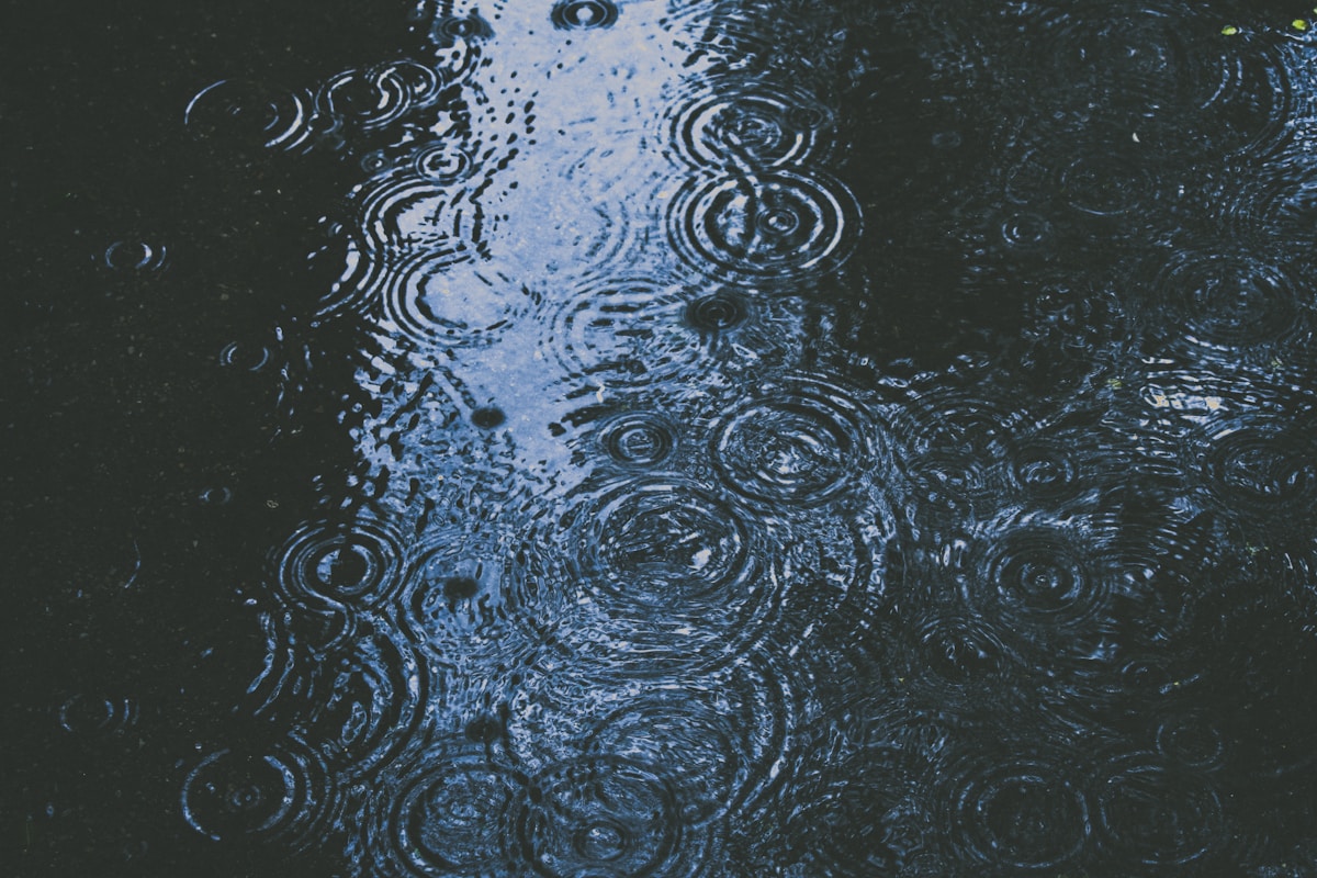 Runner wearing a waterproof cap in rainy conditions